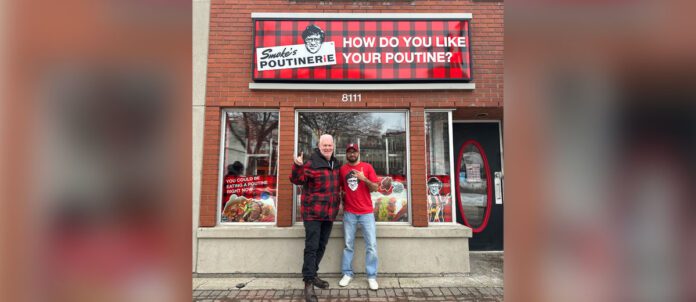 Photo of president & COO, Mark Cunningham and franchisee Gurinder Garcha