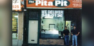 Pita Pit founders John and Nelson in front of the first ever Pita Pit location in Kingston, Ontario, in 1995