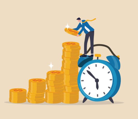 Employee stacking up coins standing on a clock