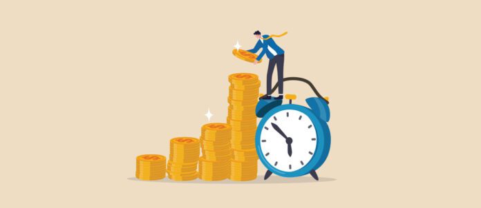 Employee stacking up coins standing on a clock