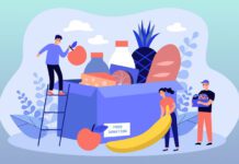 Group of volunteers gathering grocery box to help communities