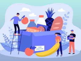 Group of volunteers gathering grocery box to help communities