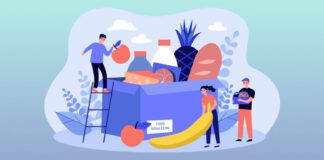 Group of volunteers gathering grocery box to help communities
