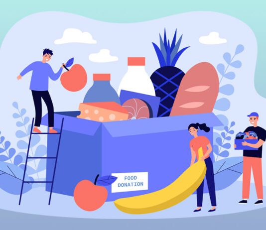 Group of volunteers gathering grocery box to help communities
