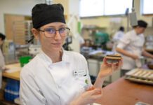 VIU Baking and Pastry Arts Management Diploma Program student Shayla Jane Heslin holds up a Nanaimo bar
