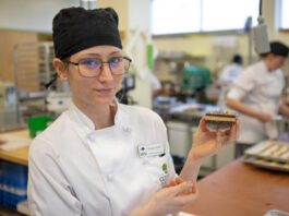 VIU Baking and Pastry Arts Management Diploma Program student Shayla Jane Heslin holds up a Nanaimo bar