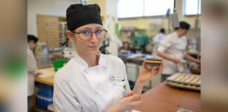 VIU Baking and Pastry Arts Management Diploma Program student Shayla Jane Heslin holds up a Nanaimo bar
