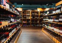 Wine bottles on shelves in liquor store