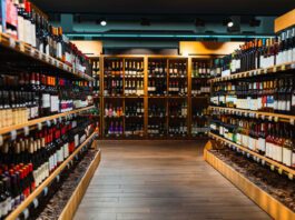 Wine bottles on shelves in liquor store