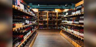 Wine bottles on shelves in liquor store