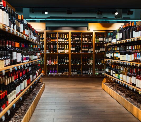 Wine bottles on shelves in liquor store