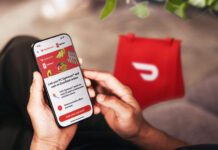 Person holding cellphone with DoorDash app open linking to PC Optimum