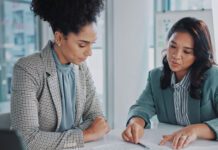 HR representative going over document with employee