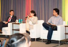 Guest speakers talking on stage at Top-30-Under-30 2025 Summit