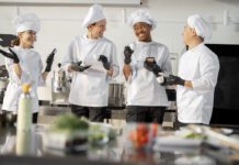 Group of culinary students drinking cups of coffee together