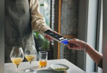 Customer paying with credit card at restaurant