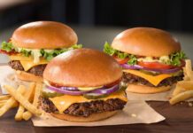 Three Jollibee Angus Beef Burgers on a table