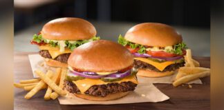 Three Jollibee Angus Beef Burgers on a table